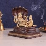 Pure Brass Resting Vishnu Lakshmi on Sheshanaag Idol - 6.9" Dual Tone Sculpture | Divine Couple Hindu Murti for Home Temple (133 characters)